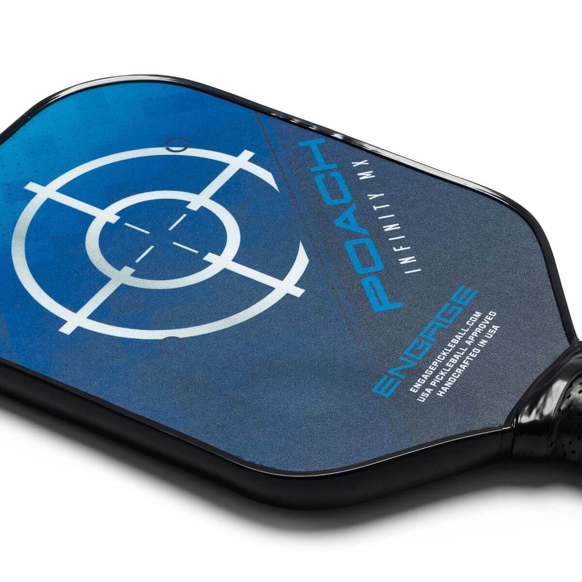 Corner view of a blue pickleball paddle with a target design, POACH INFINITY MX text, and ENGAGE logo.
