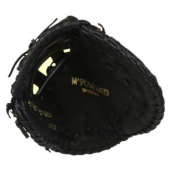 Top-down view of a black first base mitt with gold M^POWERED BASEBALL text and yellow accents.