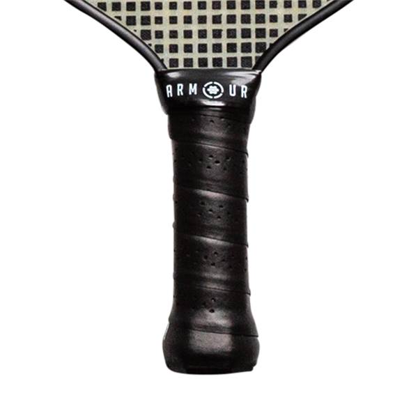 Close-up of a black pickleball paddle grip with Armour branding and a perforated texture.