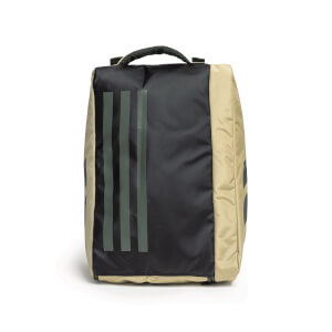 Front view of a boxy black and tan bag featuring three vertical grey stripes on the front panel and a black mesh top handle.