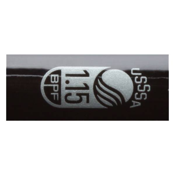 Close-up of a black tee ball bat with BPF 1.15 and USSSA markings.