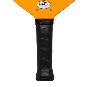 Close-up of a black pickleball paddle grip with embossed PROKENNEX text and an orange head with USA PICKLEBALL APPROVED logo.