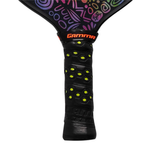 Close-up of a black pickleball paddle grip with yellow honeycomb pattern and GAMMA logo.