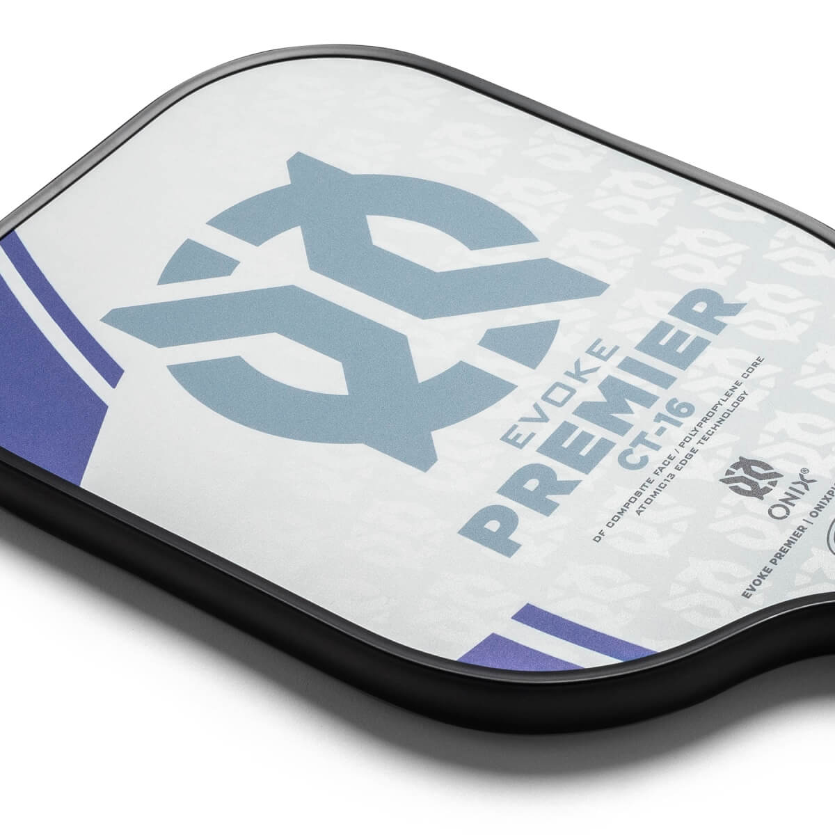 Corner view of a white pickleball paddle with a large blue logo, PREMIER CT-16 text, and purple stripes.