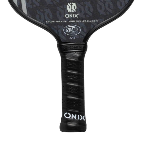 Close-up of a black pickleball paddle grip with ONIX branding and USA Pickleball Approved logo.