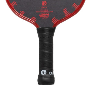 Close-up of a black pickleball paddle grip with USAPA approved text and red accents on the paddle face.
