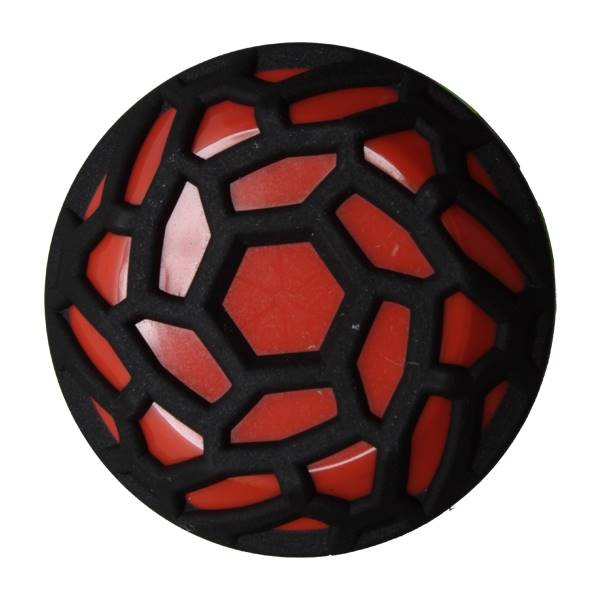 Top-down view of a black and red softball with a honeycomb pattern.