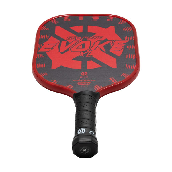 Top-down view of a red pickleball paddle with a black graphite surface, EVOKE XL text, and a black grip.