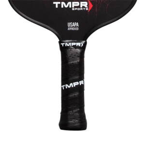 Close-up of a black pickleball paddle grip with perforations and TMPR branding.