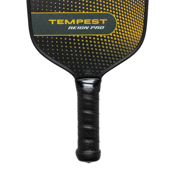 Top-down view of a black pickleball paddle with yellow dot pattern and TEMPEST REIGN PRO text.