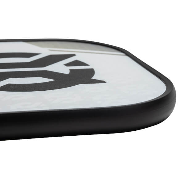 Corner view of a white pickleball paddle with a black border and a large black graphic.