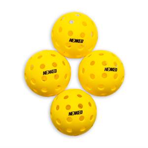 Top-down view of four yellow pickleball balls with NEXXED branding and circular holes.