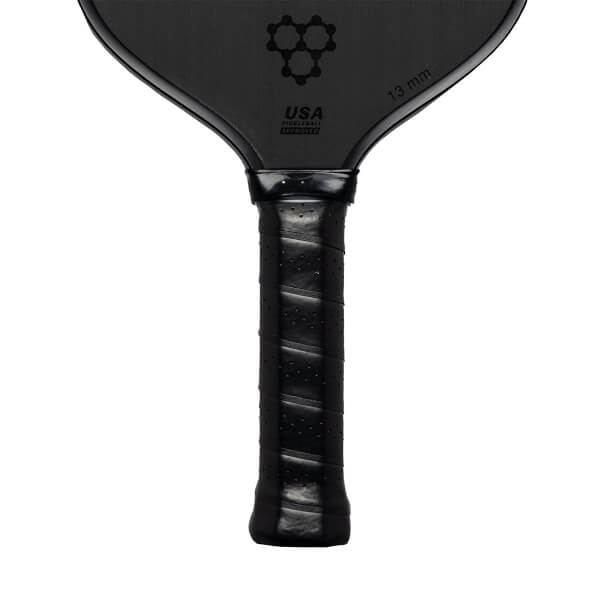 Top-down view of a black pickleball paddle with a honeycomb logo and USA PICKLEBALL APPROVED text.