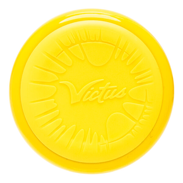 Top-down view of a yellow baseball bat end cap with embossed Victus logo and radial lines.