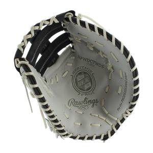 Top-down view of a white Rawlings Heritage Pro 13 first base mitt with black lacing and For the Professional player text.