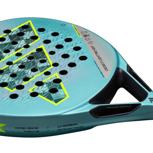 Close-up of a teal padel racket showing yellow accents, black holes, and "CROSS IT LIGHT PRO-EDT" text.