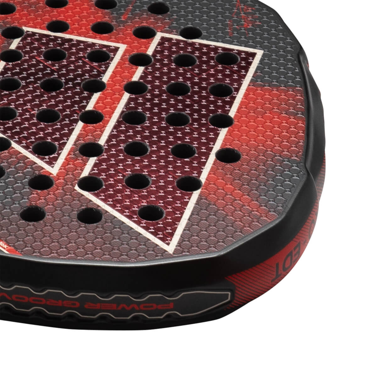 Corner view of a black and red padel racket with hexagonal pattern, showing "POWER GROOV" text.