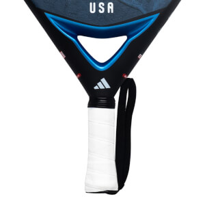 Close-up of the black Adidas padel racket bridge and handle, featuring metallic blue accents, the word "USA," and a white wrapped grip.