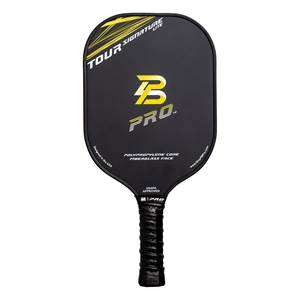 Front view of a black pickleball paddle with yellow TOUR SIGNATURE LITE text, a yellow B PRO. logo, and POLYPROPYLENE CORE FIBERGLASS FACE text.