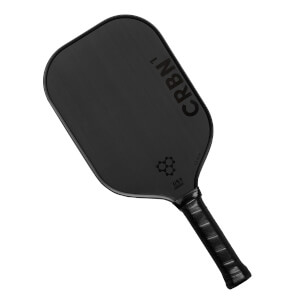 Top-down view of a black pickleball paddle with CRBN¹ branding and a honeycomb logo.