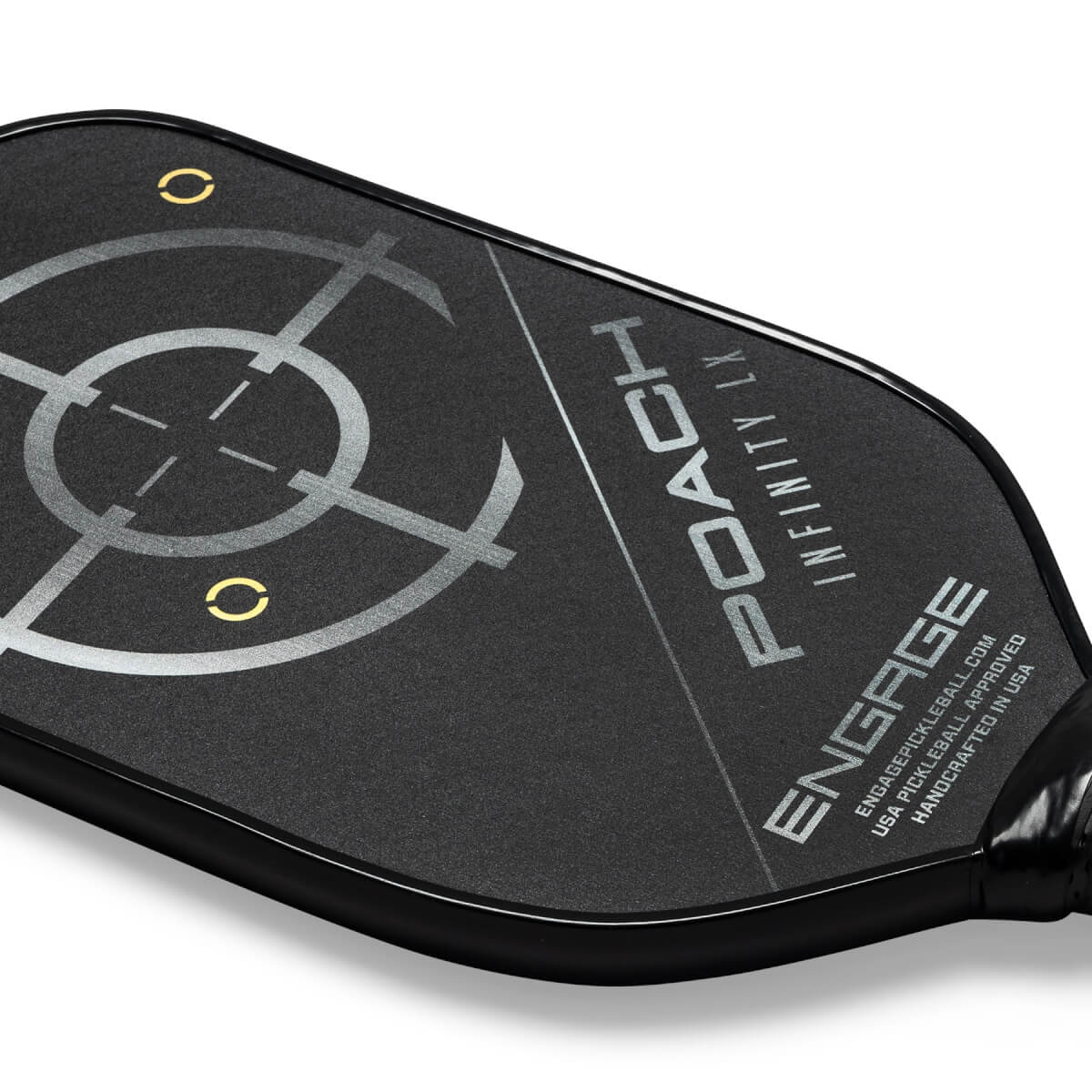 Close-up of a black pickleball paddle with a target design, POACH INFINITY LX, and ENGAGE branding.