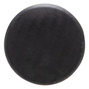 Top-down view of a black, circular puck with a matte finish.