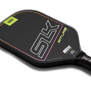 Top-down view of a black pickleball paddle with white SK logo, yellow ATLAS XL text, and a gradient edge.