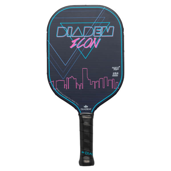 Front view of a dark blue Diadem Icon pickleball paddle with neon pink and blue geometric and city skyline graphics.