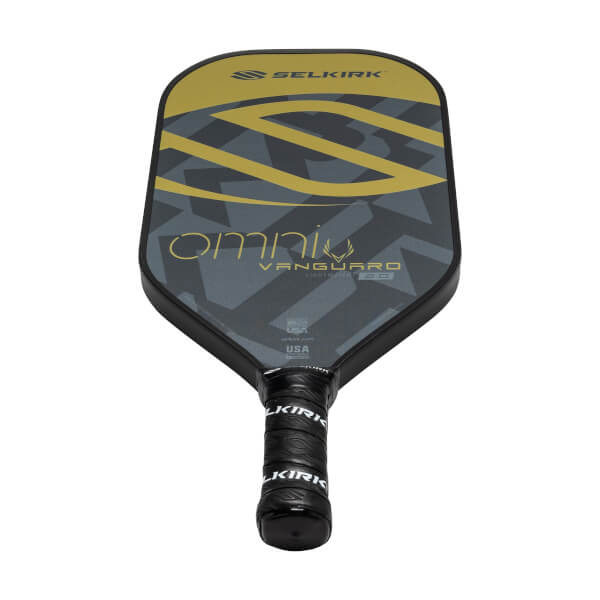Top-down view of a black pickleball paddle with gold and gray geometric design, omni text, and Selkirk branding.