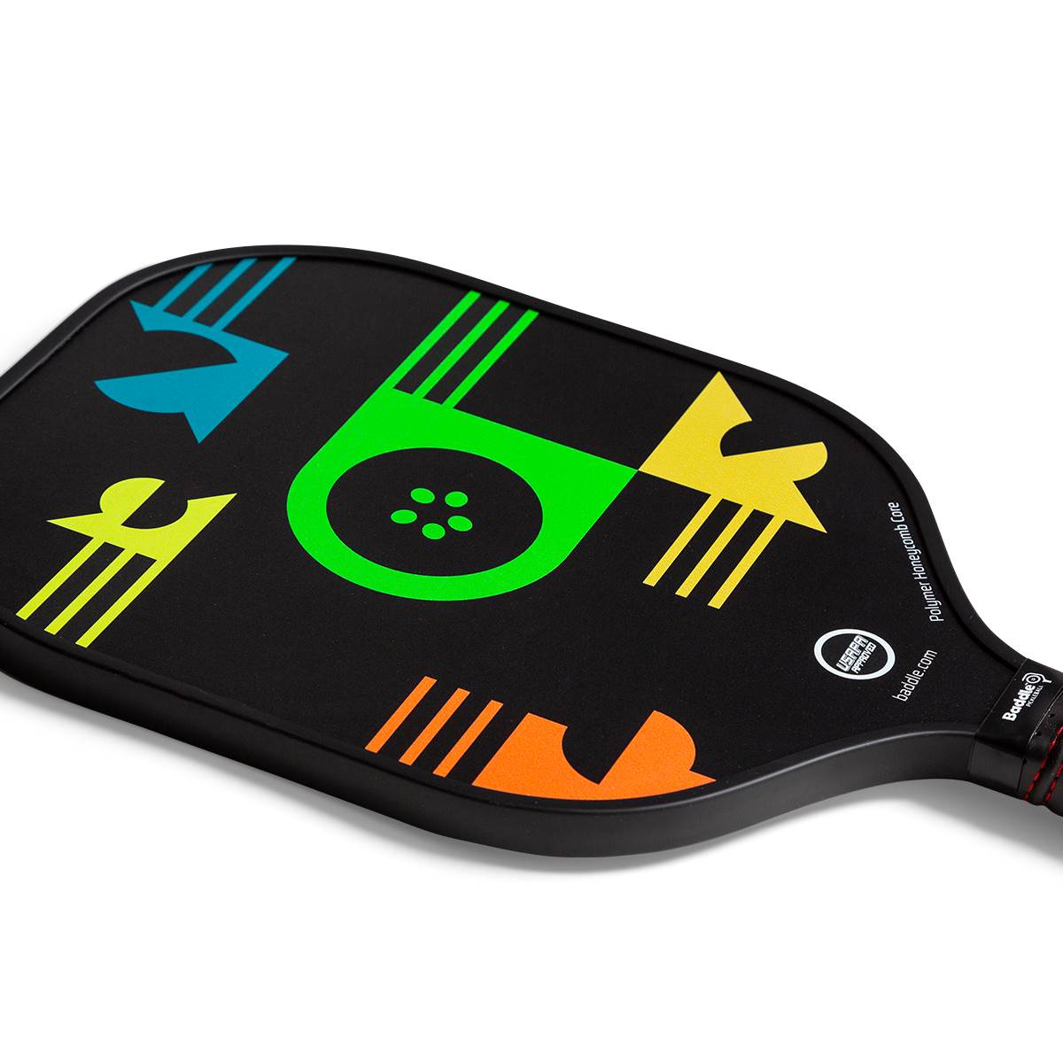 Top-down view of a black pickleball paddle with colorful geometric designs and the Baddle logo.