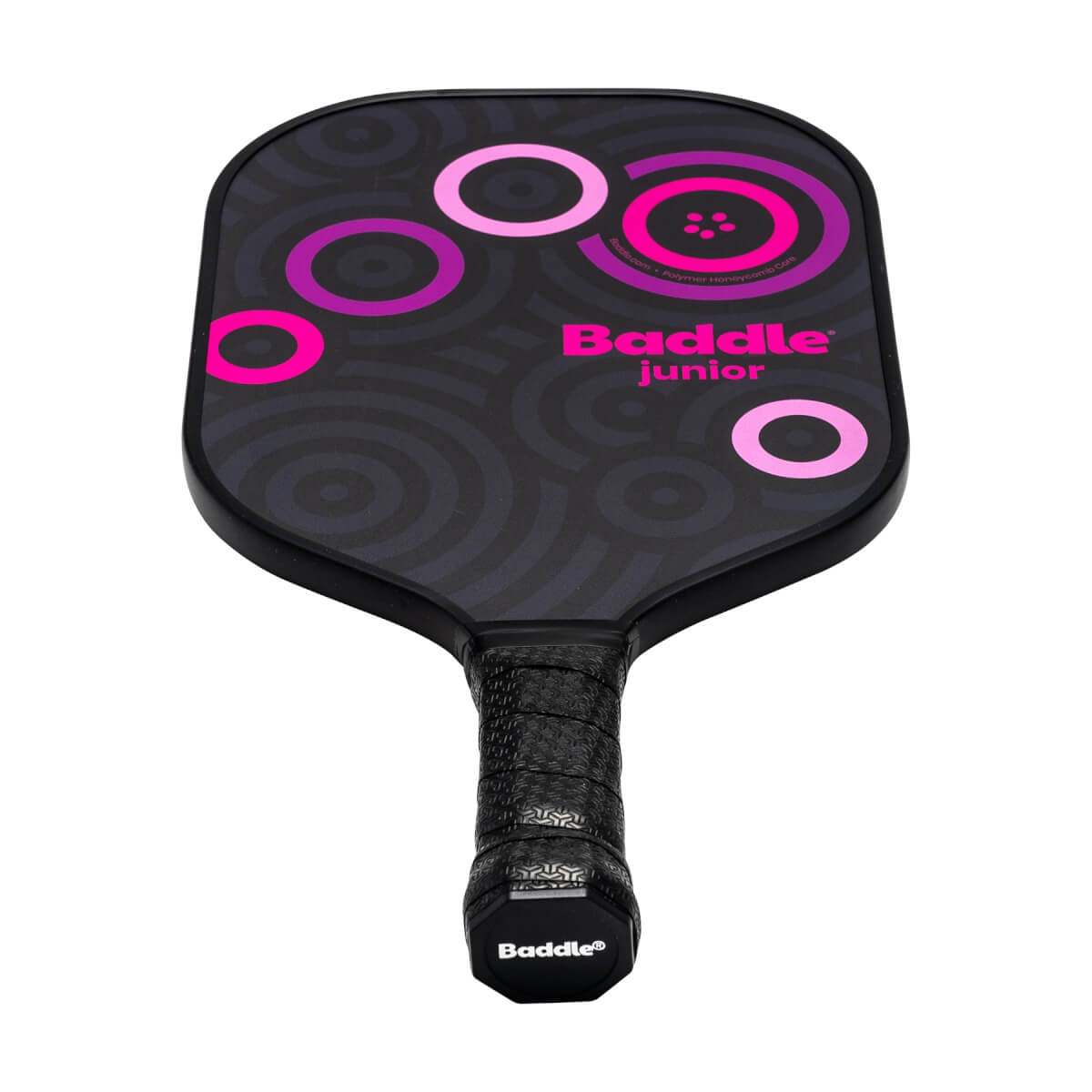 Front view of a black Baddle Junior pickleball paddle with pink circles and a textured grip.