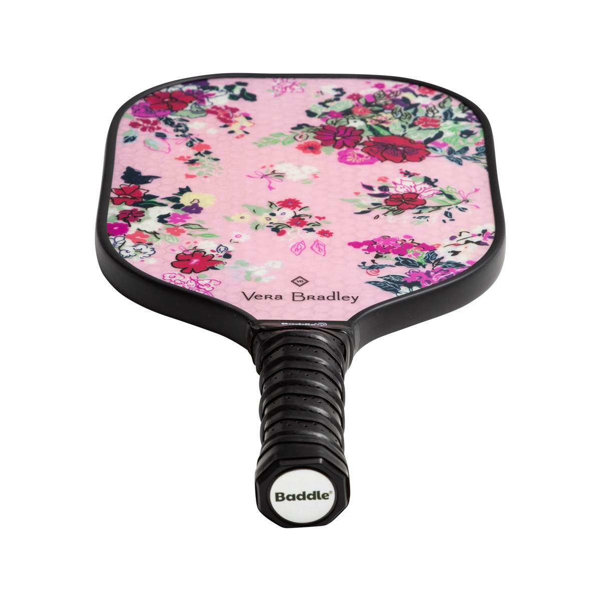 Top-down view of a pink pickleball paddle with a floral pattern, Vera Bradley branding, and a black grip with Baddle logo.
