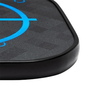 Corner view of a black pickleball paddle with blue graphic accents and a textured surface.