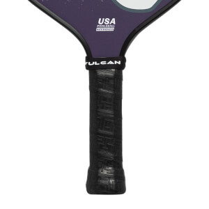 Close-up of a black pickleball paddle grip with Vulcan branding and USA Pickleball Approved text.