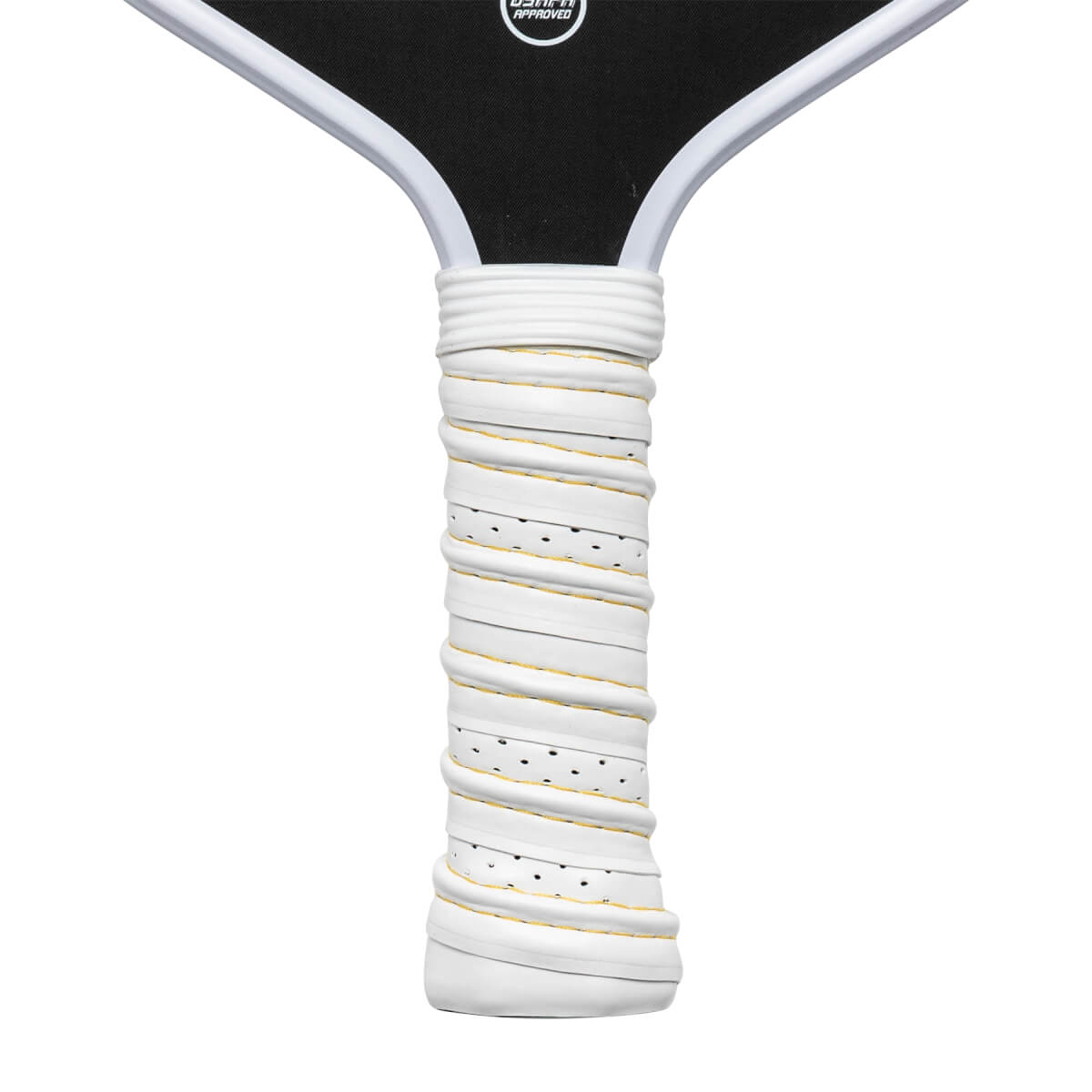 Close-up of a white pickleball paddle grip with yellow trim and black perforations.
