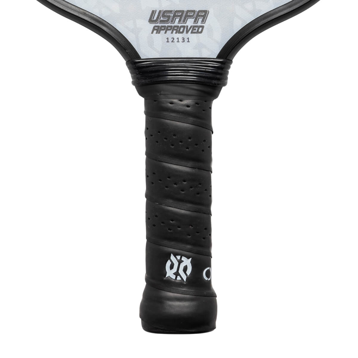 Close-up of a black pickleball paddle grip with perforated texture and white logo.