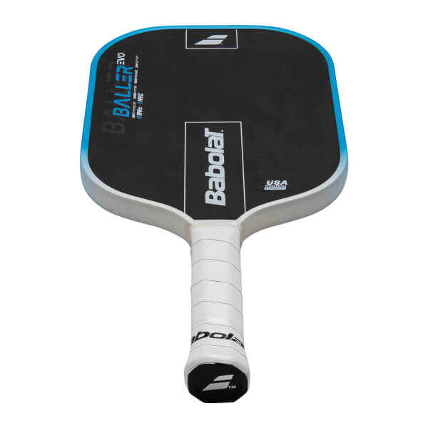 Top-down view of a black pickleball paddle with blue trim, showing "BALLER EVO" and "Babolat" logos.
