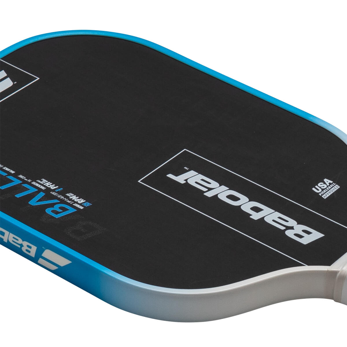 Top-down view of a black pickleball paddle with blue trim, showing the "Babolat" logo and "USA PICKLEBALL APPROVED" text.