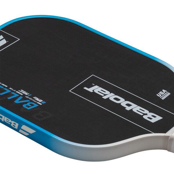 Top-down view of a black pickleball paddle with blue trim, showing the "Babolat" logo and "USA PICKLEBALL APPROVED" text.