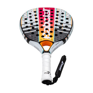 Front view of a multi-colored Babolat padel racket with a striped face, numerous holes, white grip, and black wrist strap.
