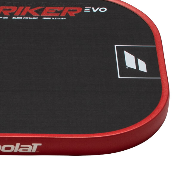 Corner view of a black paddle with red trim, showing "STRIKER EVO" and a white logo.