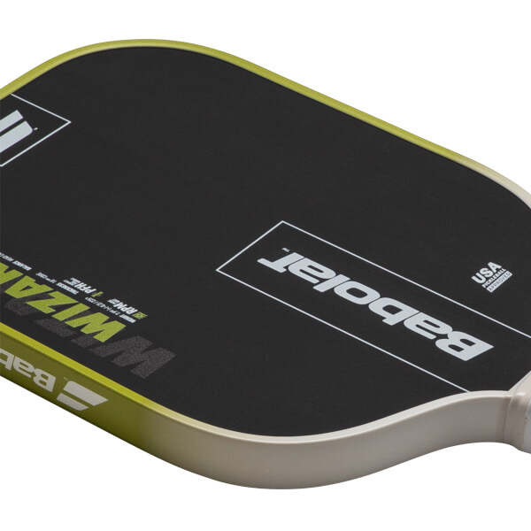 Close-up of a pickleball paddle showing the "WIZARD" text, "Babolat" logo, and "USA PICKLEBALL APPROVED" seal.