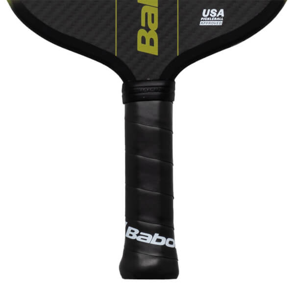 Close-up of the handle showing the black grip with "Babolat" logo and the "USA PICKLEBALL APPROVED" label on the paddle head.
