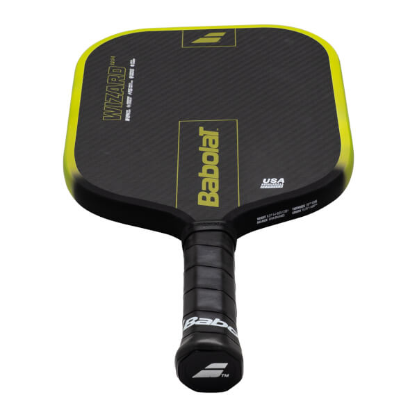 Top-down view of a black pickleball paddle with a yellow edge, featuring "WIZARD PRO" and "Babolat" text.