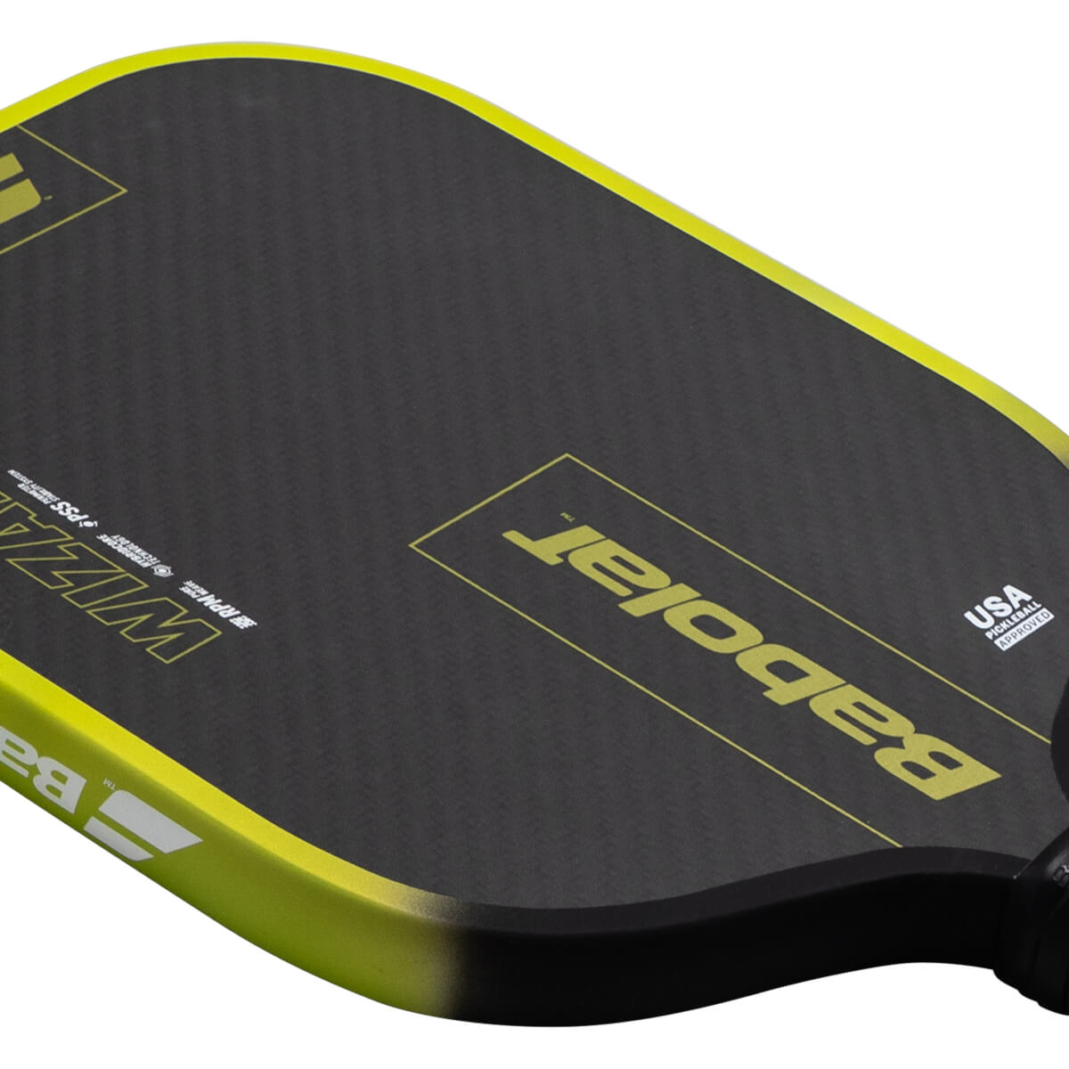Top-down view of a black pickleball paddle with yellow trim, showing the "Babolat" logo and "USA PICKLEBALL APPROVED" text.