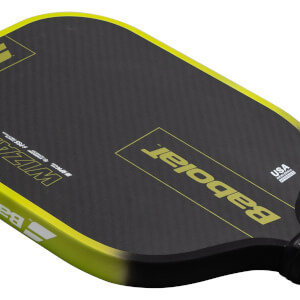Top-down view of a black pickleball paddle with yellow trim, showing the "Babolat" logo and "USA PICKLEBALL APPROVED" text.