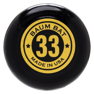 Close-up of a black baseball bat knob with a yellow circular label showing "BAUM BAT 33 MADE IN USA".