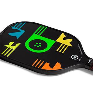 Top-down view of a black pickleball paddle with colorful geometric designs and the Baddle logo.