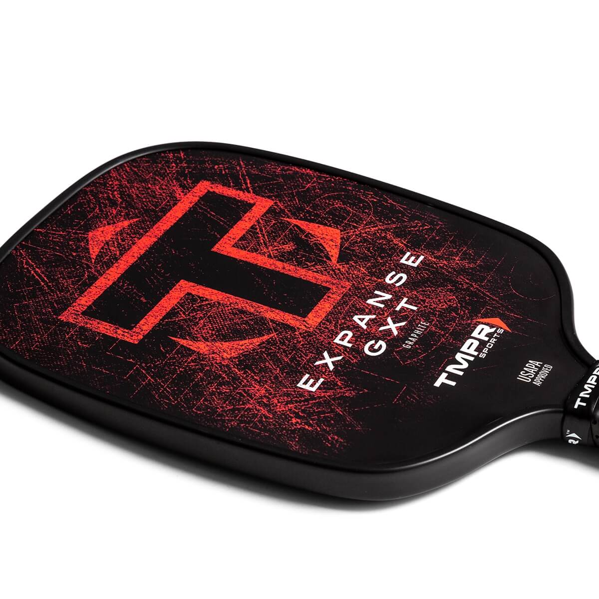Top-down view of a black pickleball paddle with a red T logo, EXPANSE GXT text, and TMPR SPORTS branding.