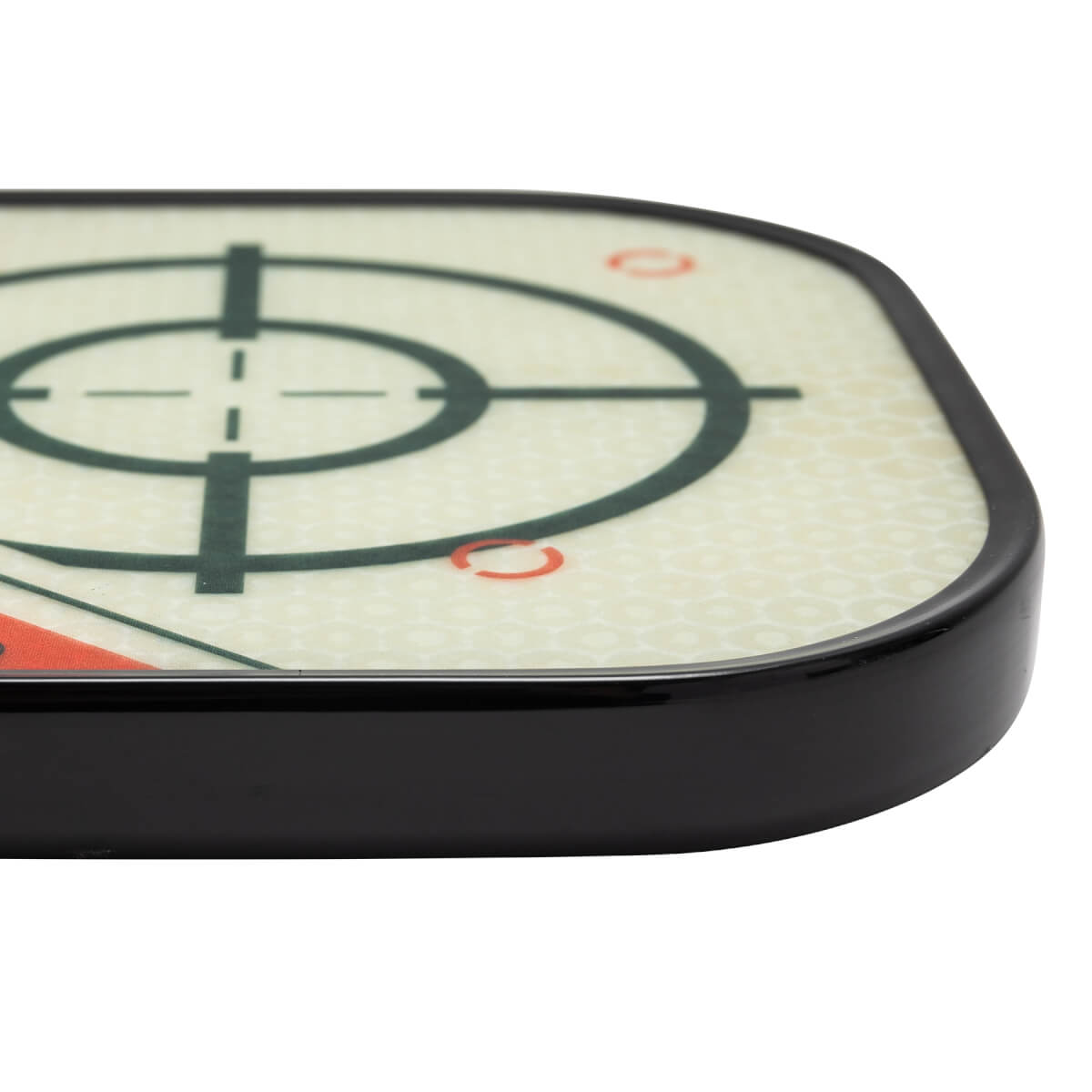 Corner view of a white pickleball paddle with a black edge and target design.